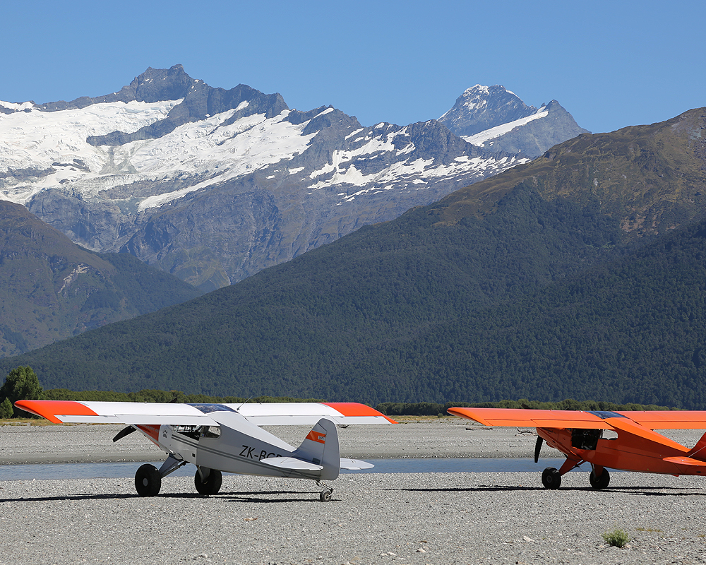 DeltaHawk Bearhawk planes with mountains behind